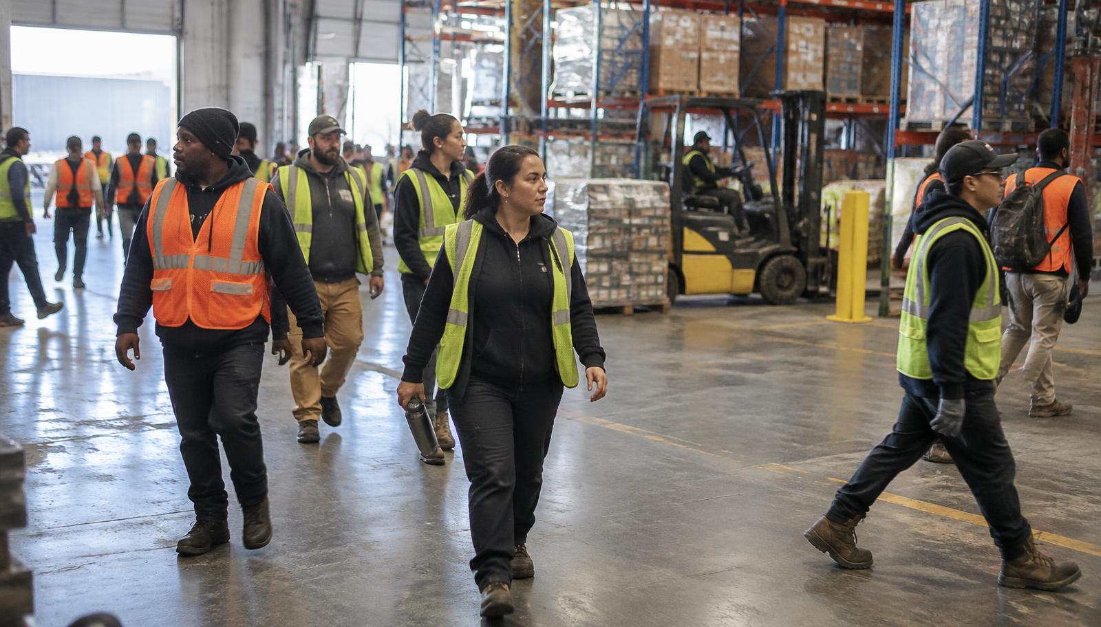 Employees across a large multi-site organization at shift change