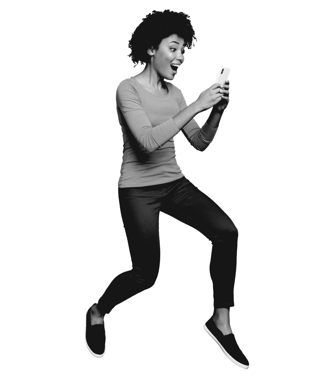 woman black and white jumping on her phone